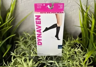 A pair of dynaven knee high socks in a box