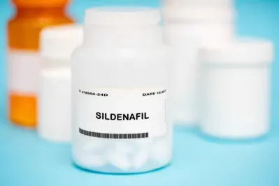 A bottle of pills that says ' sildenafil ' on it