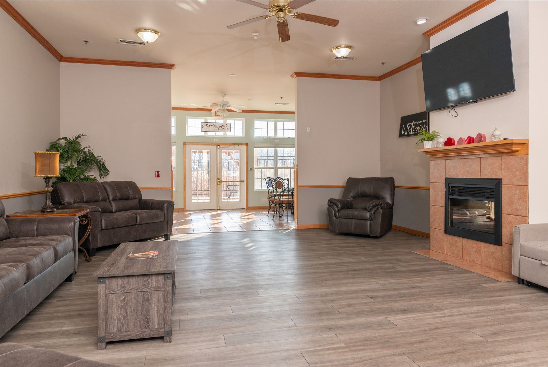 A living room filled with furniture and a fireplace.