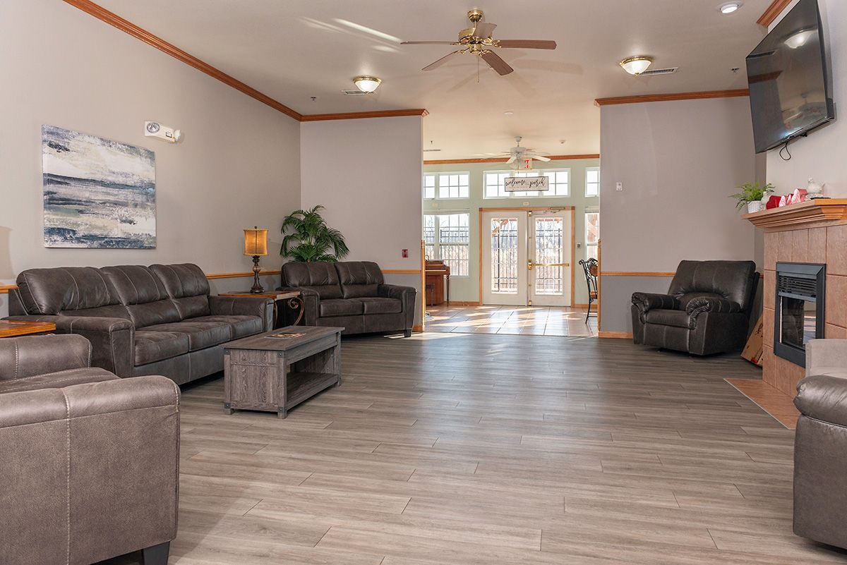 A living room filled with furniture and a fireplace.