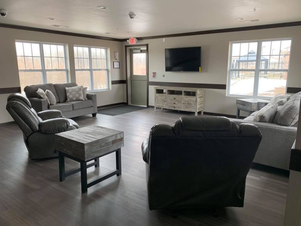 A living room filled with furniture and a flat screen tv.