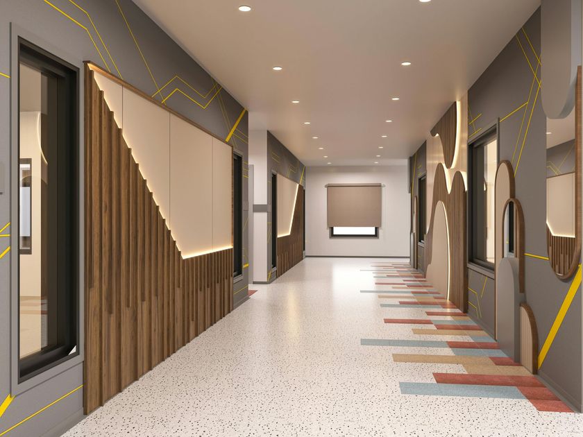Modern hallway with wood accents, patterned floor tiles, recessed lights, and a window at the far end
