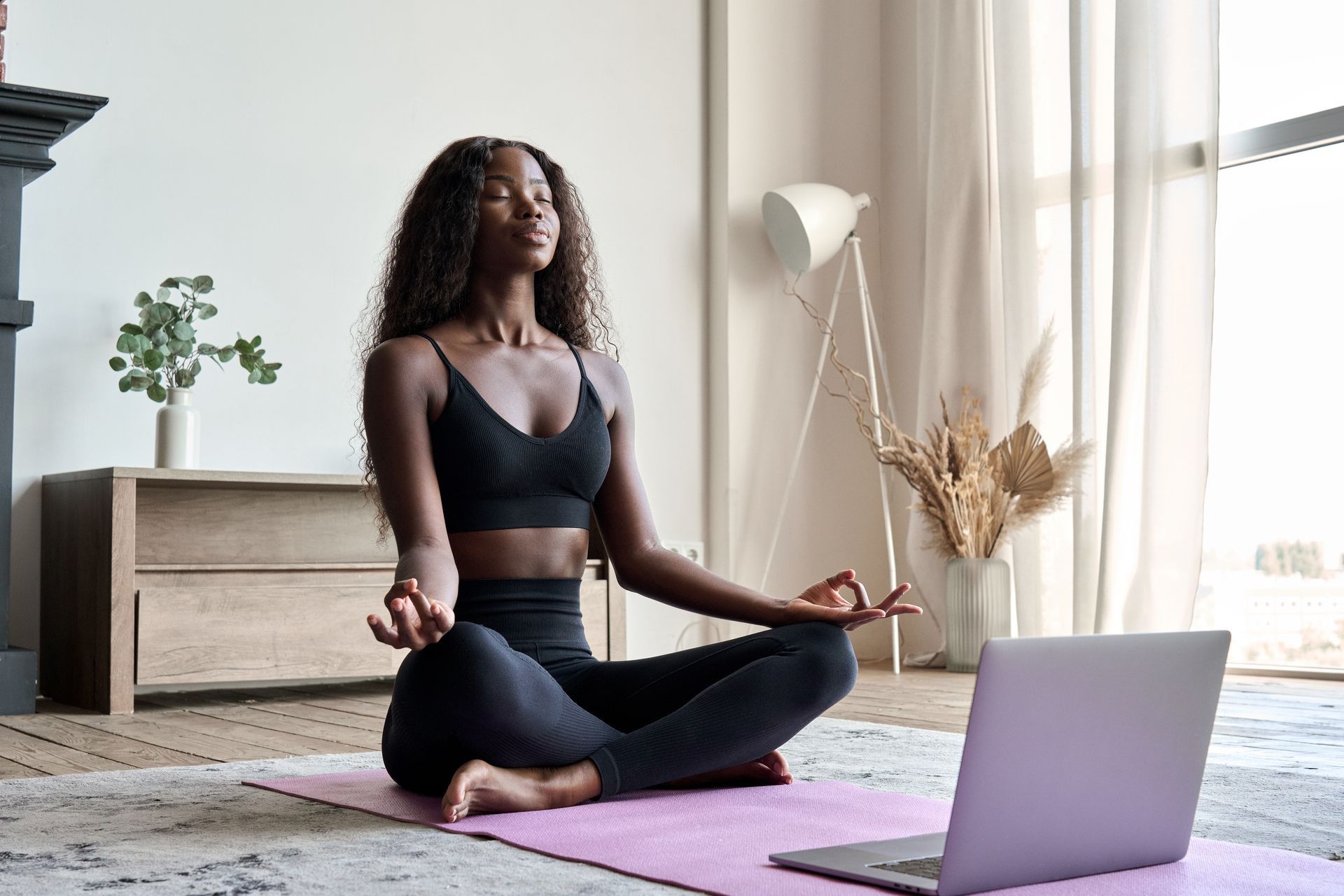 a group of people are doing yoga together in a fitness studio
