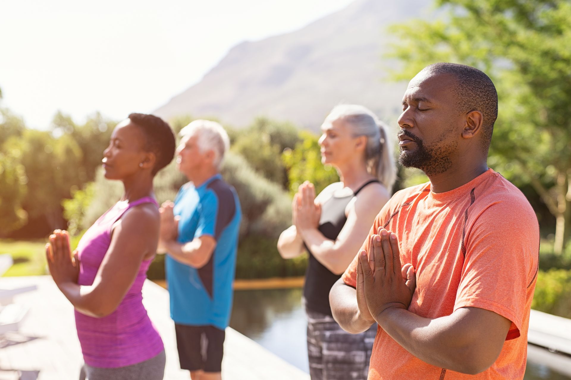 a group of women are practicing yoga in a gym