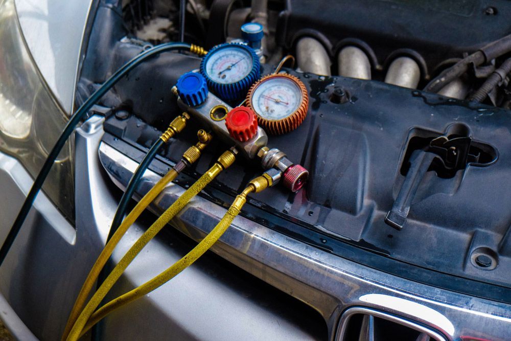 A Close up Of a Car Engine with Gauges Attached to It — A & K Auto Electrical & Air Conditioning in Quirindi, NSW