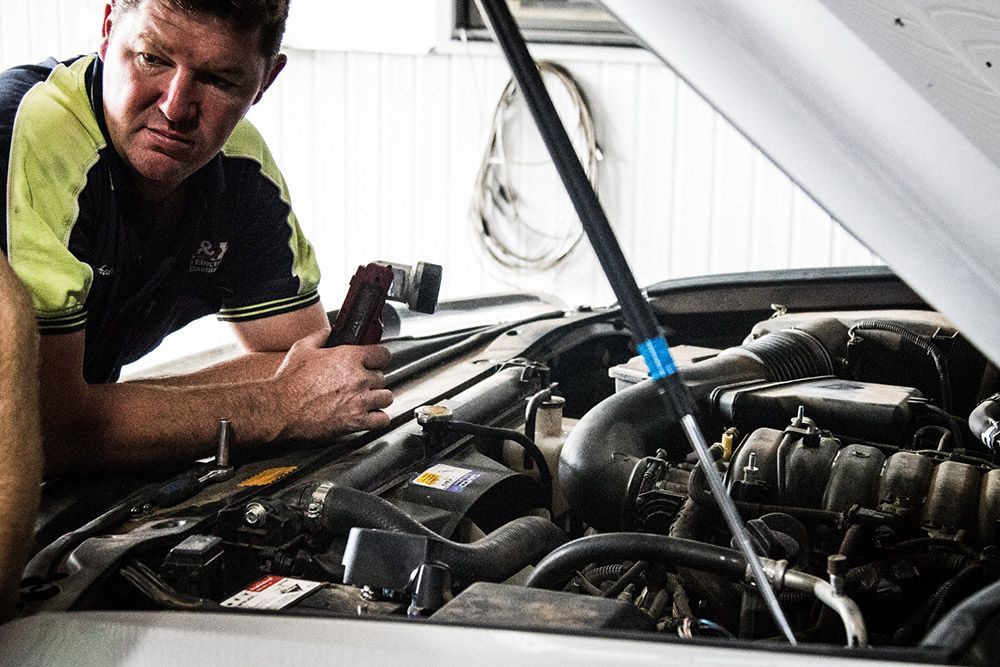 Technician using a laptop to diagnose auto electrical issues — Auto Electrical & Air Conditioning in Tamworth, NSW