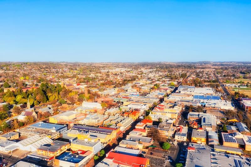 An Aerial View Of A City With Lots Of Buildings And Trees — Auto Electrical & Air Conditioning in Armidale, NSW