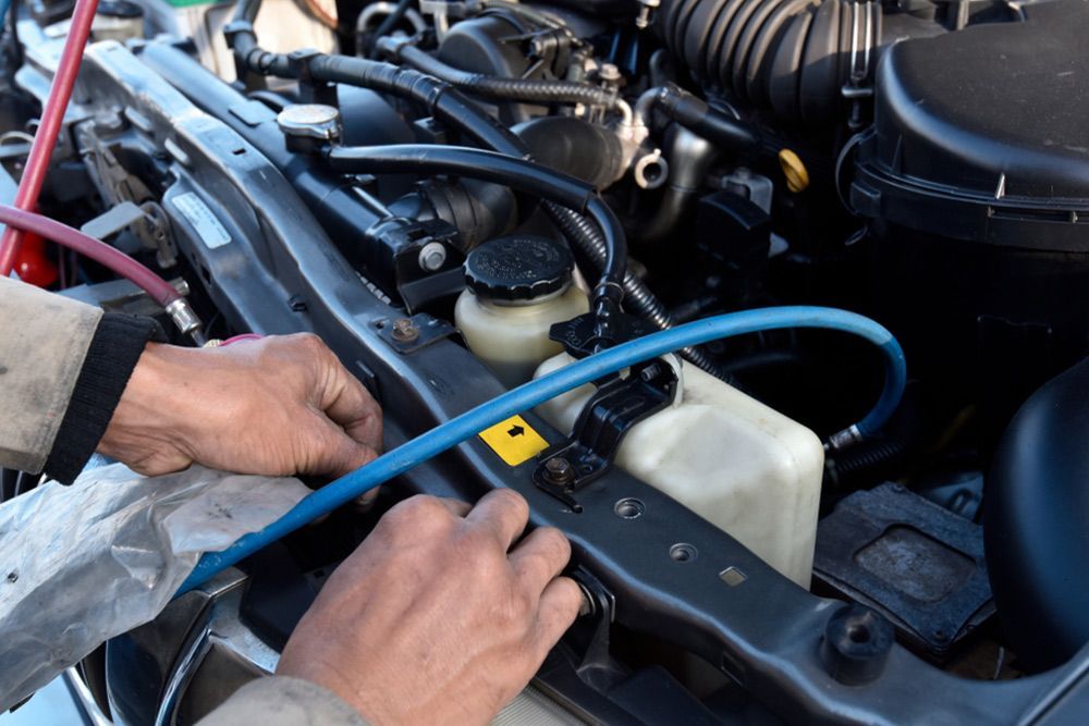 Mobile auto electrician carrying out repairs on a car — Auto Electrical & Air Conditioning in Tamworth, NSW