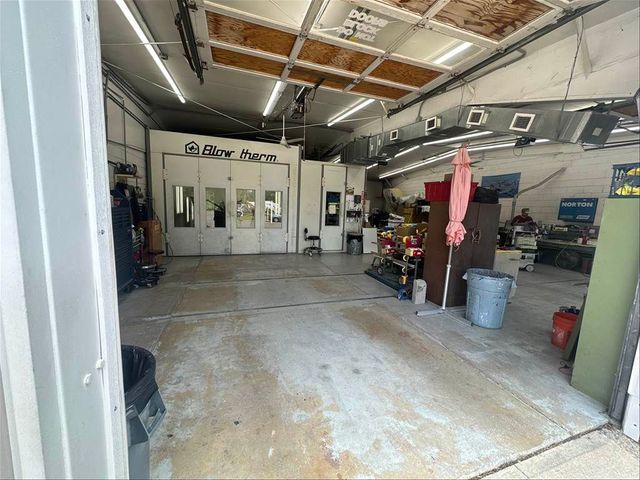 Paint booth and work area at Auto Craftman and Collision