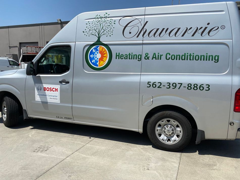 Silver Chavarrie Heating & Air Conditioning van with logo and phone number.
