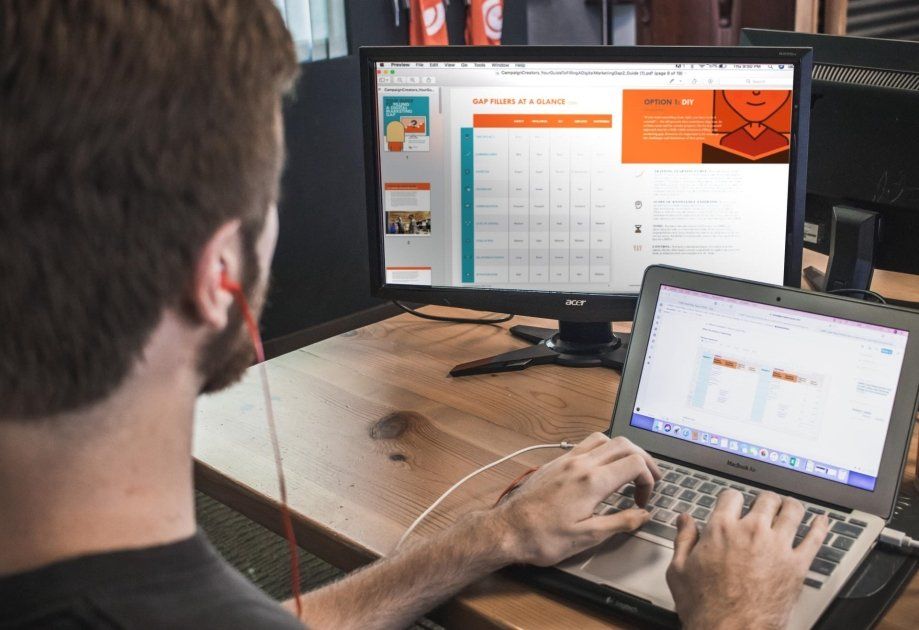 Web designer working on website layouts with dual screens – Webshure website design in Lambton