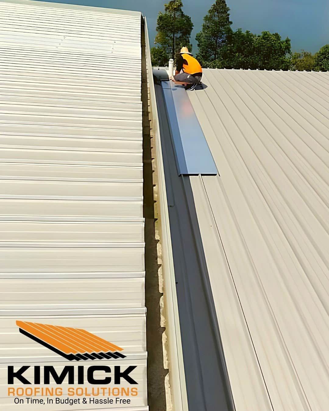 A Man Is Working On The Roof Of — Kimick Roofing Solutions In Wyong, NSW