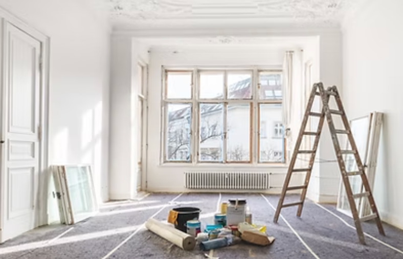 Hands working with tools on wood; detail of woodworking.
