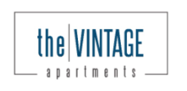 Logo for “the VINTAGE apartments” in blue and gray on a white background