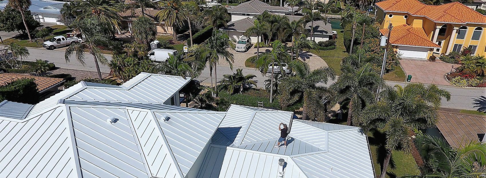 Man Inspecting the Roof — Lakewood Ranch, FL — Charlie Rice Roofing, Inc.