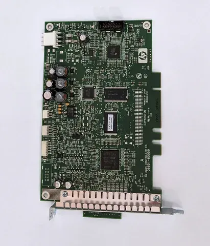 Green circuit board with connectors and electronic components on a white background