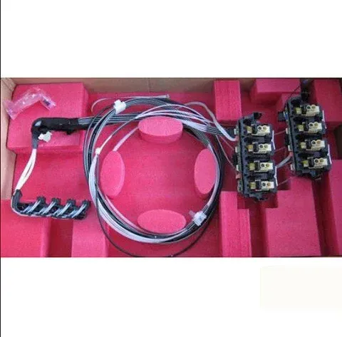 Pink case holding bundled wires and several small black electronic modules with connectors