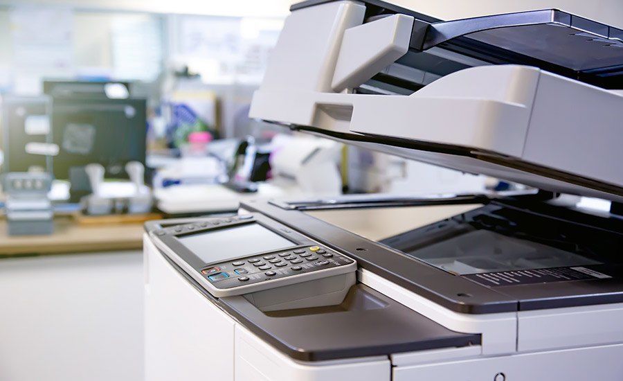 Office photocopier with control panel in a bright workspace
