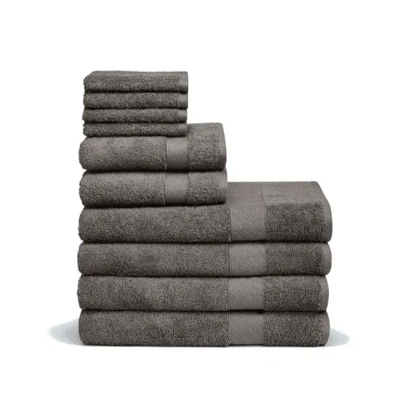 Stack of clean, white towels, one rolled on top.