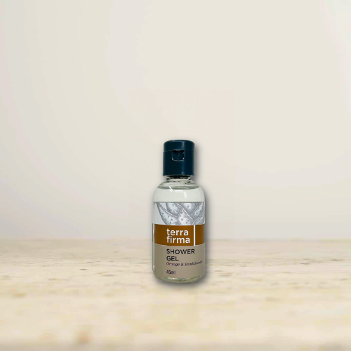Terra Firma Whitening Gel bottle on a light-colored surface against a cream background.