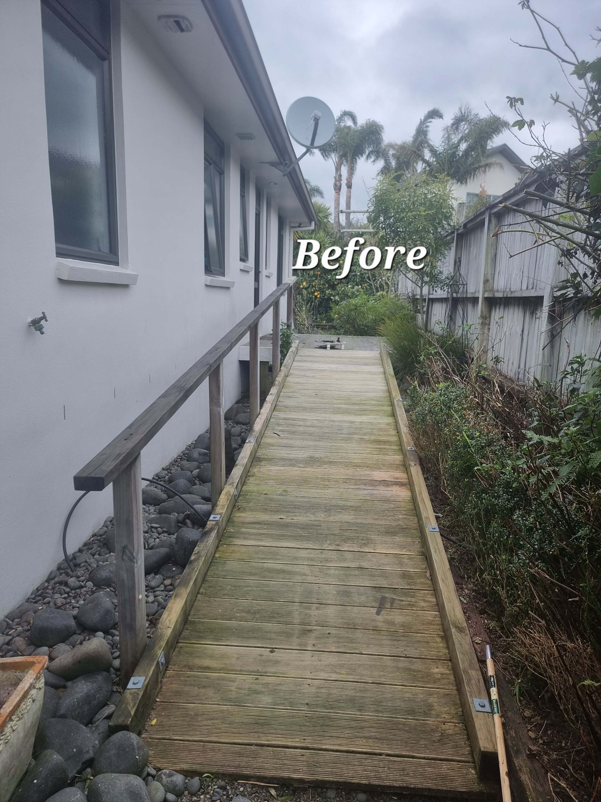 Before: narrow woven walkway beside a house and garden, viewed in perspective