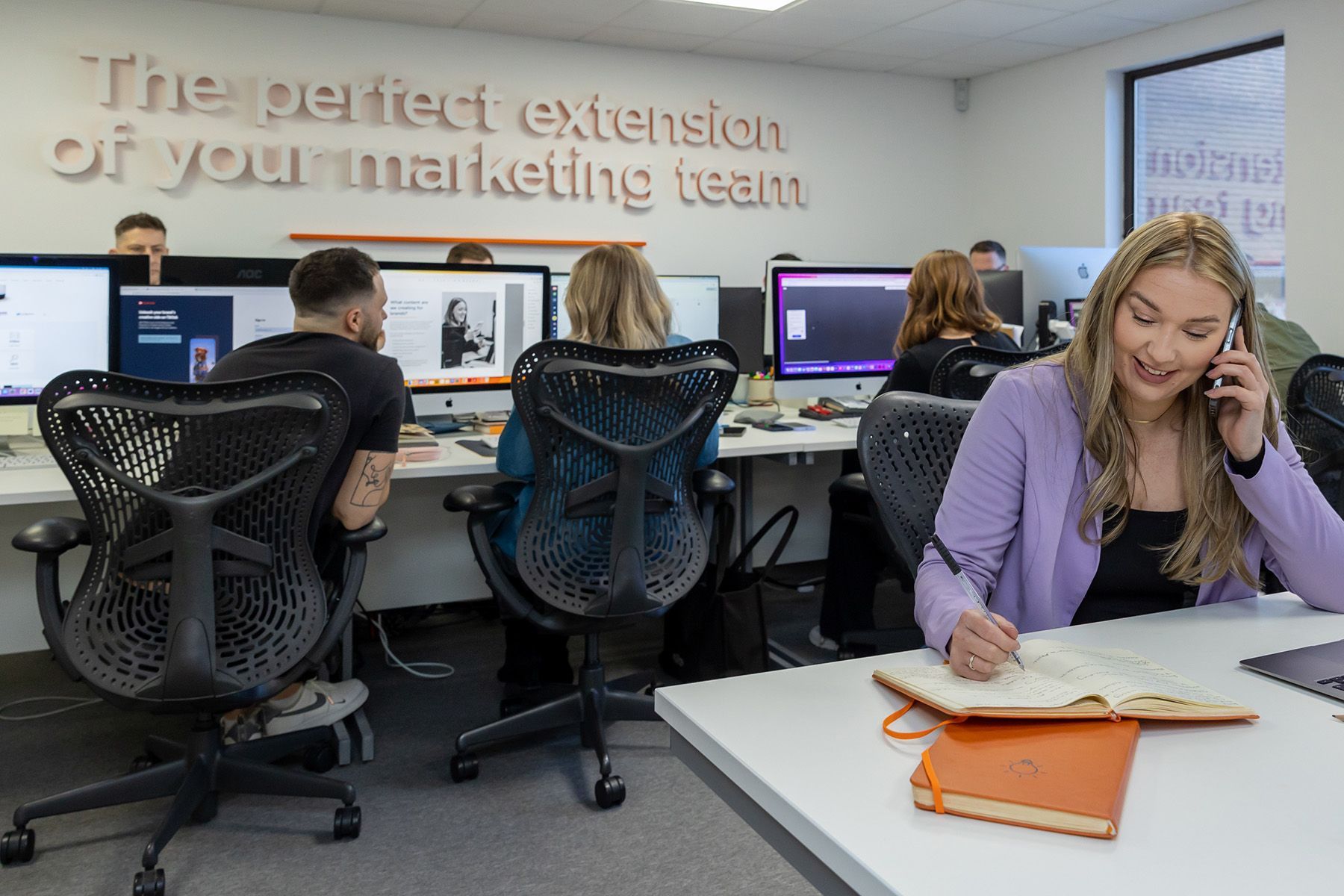 commercial photographer reading, female at work in an office