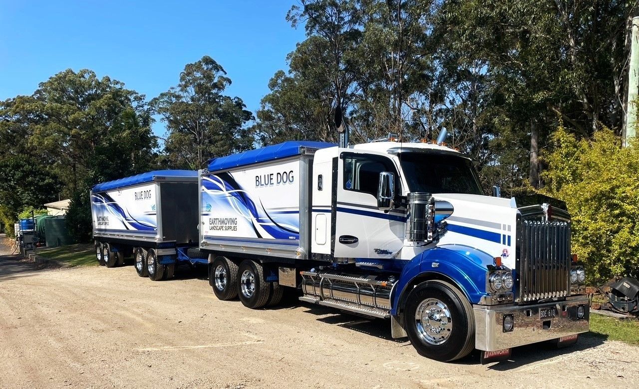 Blue and White Semi-truck With Trailer, 