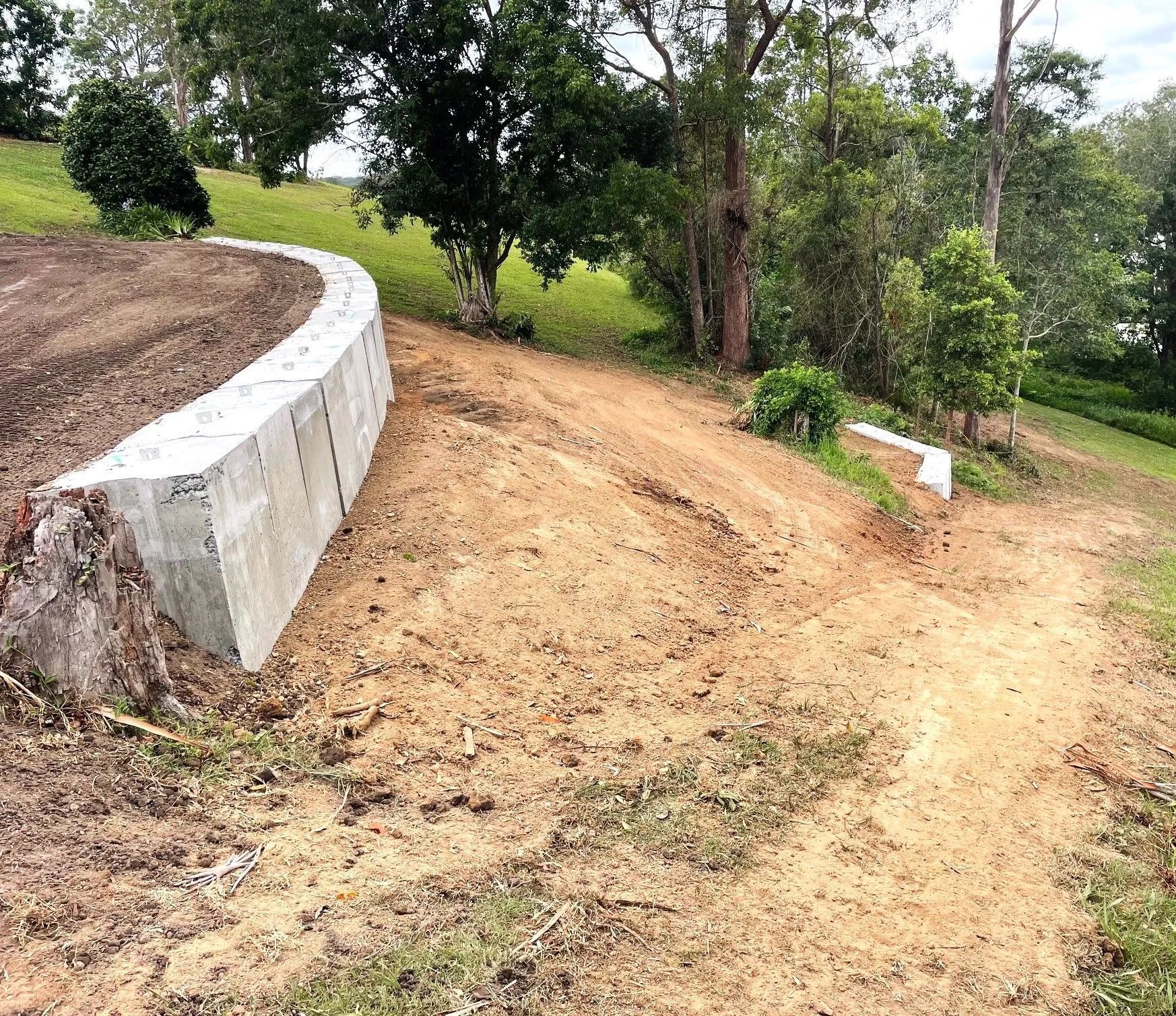 Concrete Retaining Wall on a Hill — Blue Dog Earthmoving Landscape Supplies in Newee Creek, NSW