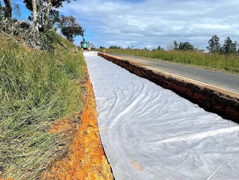 Roadside Trench With White Fabric, Likely for Drainage — Blue Dog Earthmoving Landscape Supplies in Newee Creek, NSW