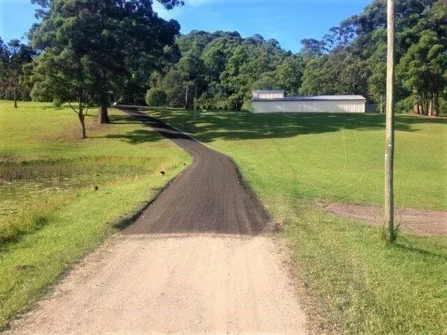 Gravel Road Transitions to Asphalt, Leading Uphill — Blue Dog Earthmoving Landscape Supplies in Newee Creek, NSW
