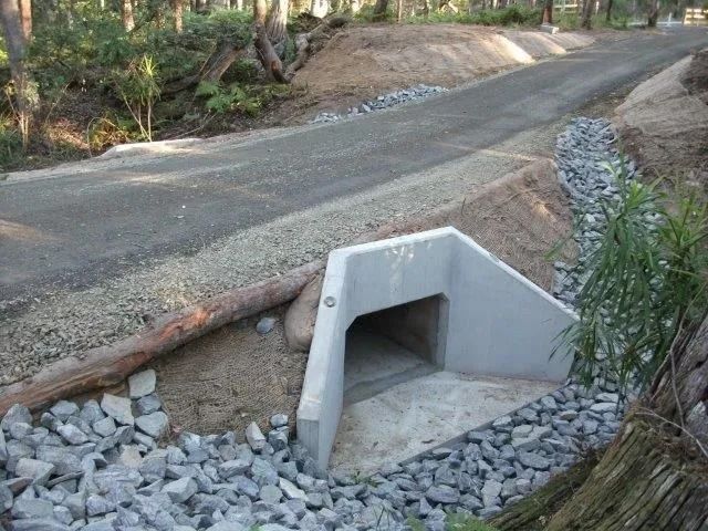 Concrete Culvert Under a Gravel Road, for Water Drainage — Blue Dog Earthmoving Landscape Supplies in Newee Creek, NSW