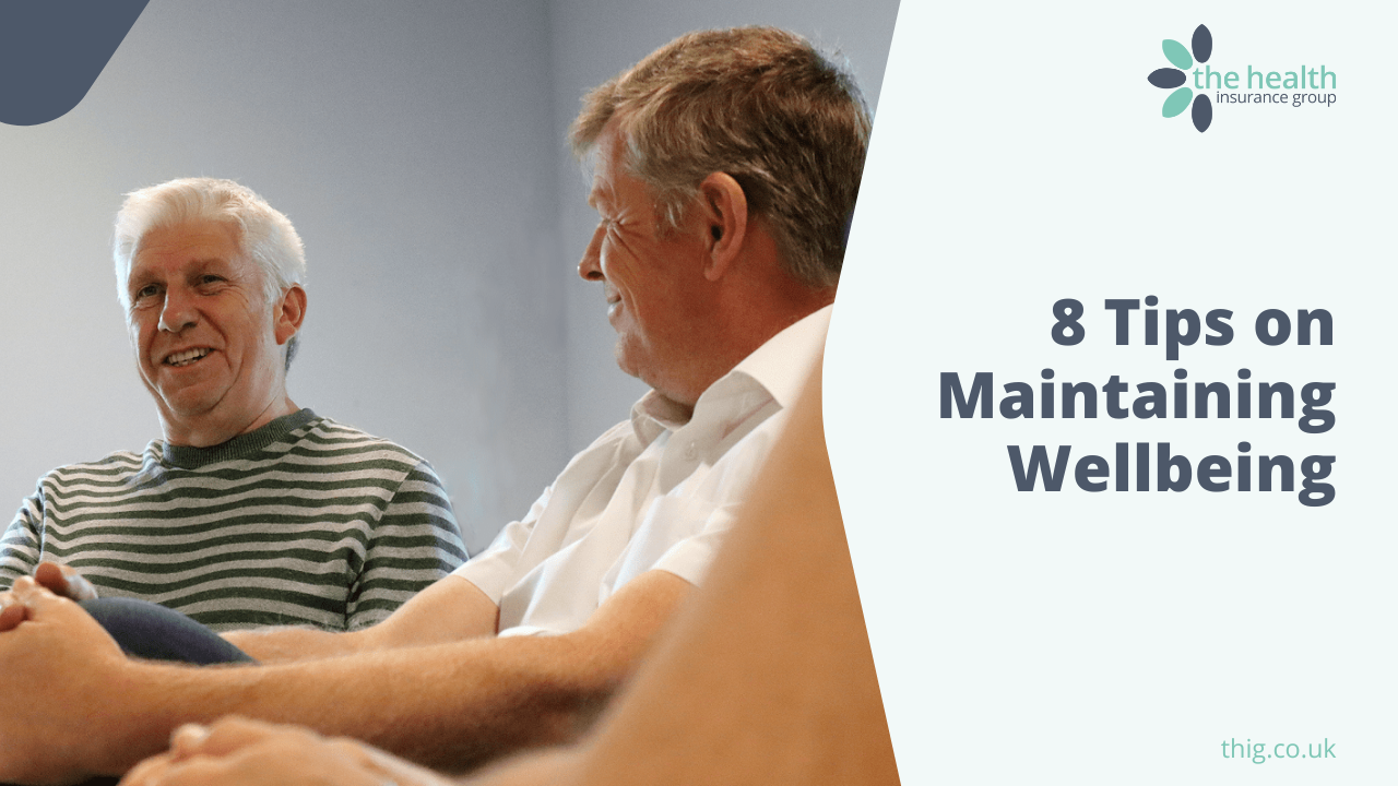 Two men chatting on a couch beside text reading “8 Tips on Maintaining Wellbeing”