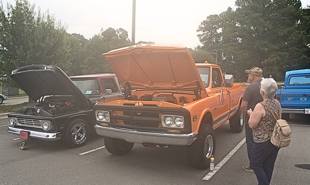 Classic pick-up trucks with hoods raised