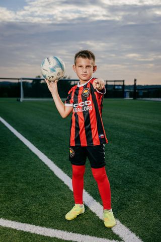 Three youth soccer players for Lake Travis Football Club