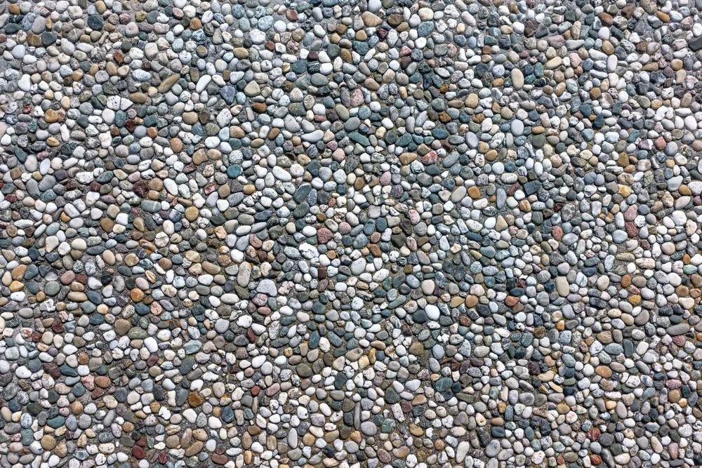 Small, Smooth, Multicolored Pebbles Tightly Packed Together — Northern Rivers Concrete Construction in Pimlico, NSW