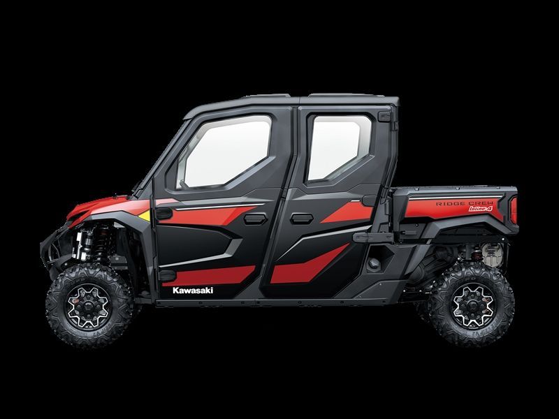 Black and red Kawasaki side-by-side vehicle with four doors and a small truck bed on a black background.