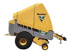 Yellow and gray Vermeer 604R Premium round baler.