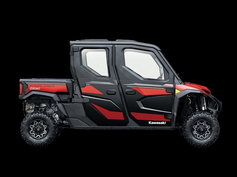 Red and black Kawasaki Teryx KRX4 1000 off-road vehicle against a black background.