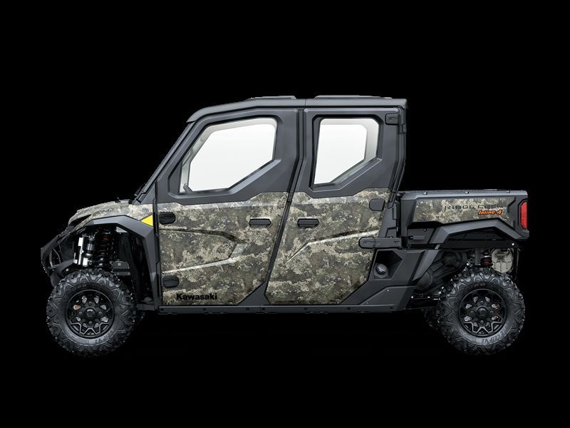 Four-door camouflage Kawasaki UTV against a black background.