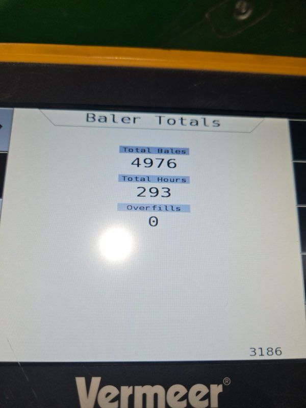 Baler totals display on a Vermeer screen showing: Total Bales: 4976, Total Hours: 293, and Overfills: 0.