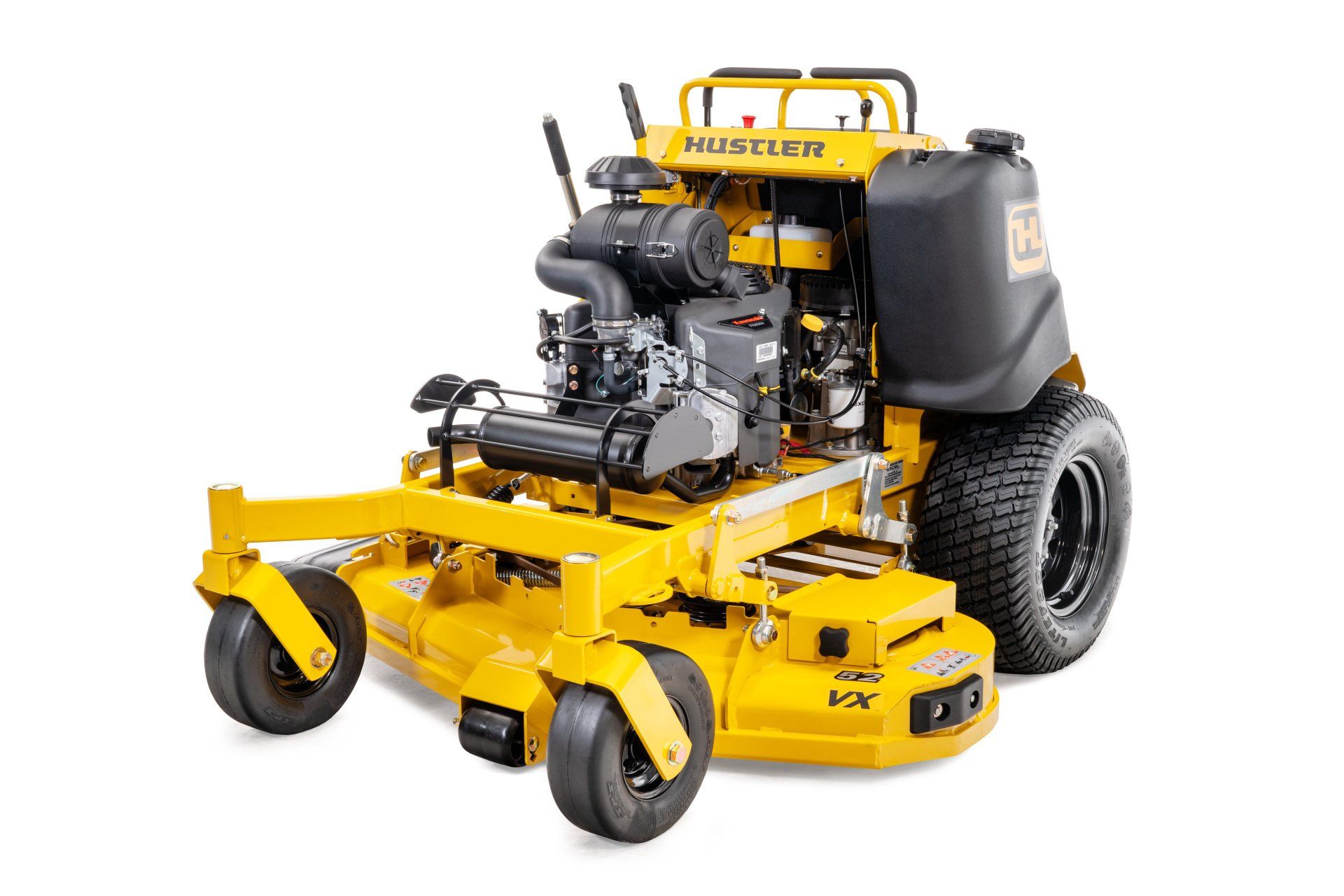 Yellow Hustler zero-turn mower on a white background, showing the engine, deck, and large tires.
