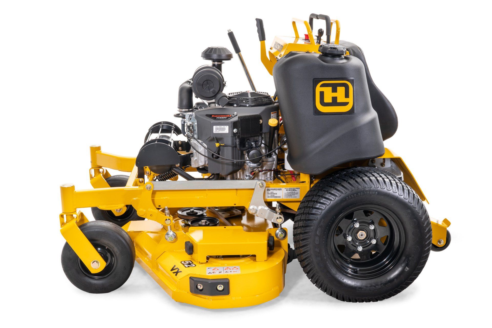 Yellow Hustler zero-turn mower, black tires, engine detail, on white background.