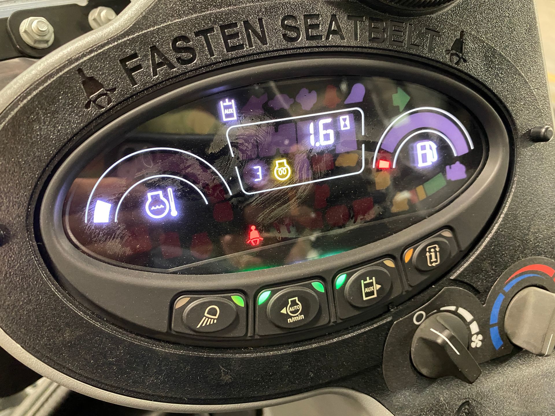 Dashboard with gauges, including battery, fuel, and engine oil. The display reads 