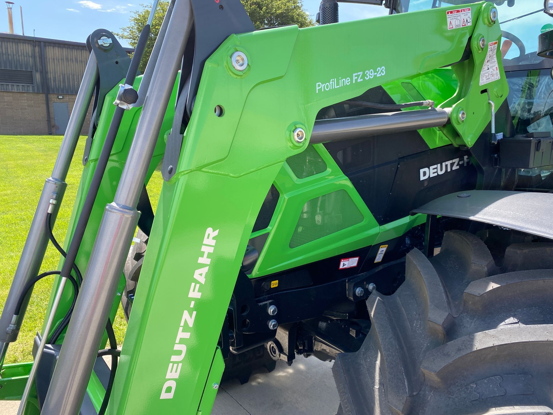 Green and black Deutz-Fahr tractor front loader.