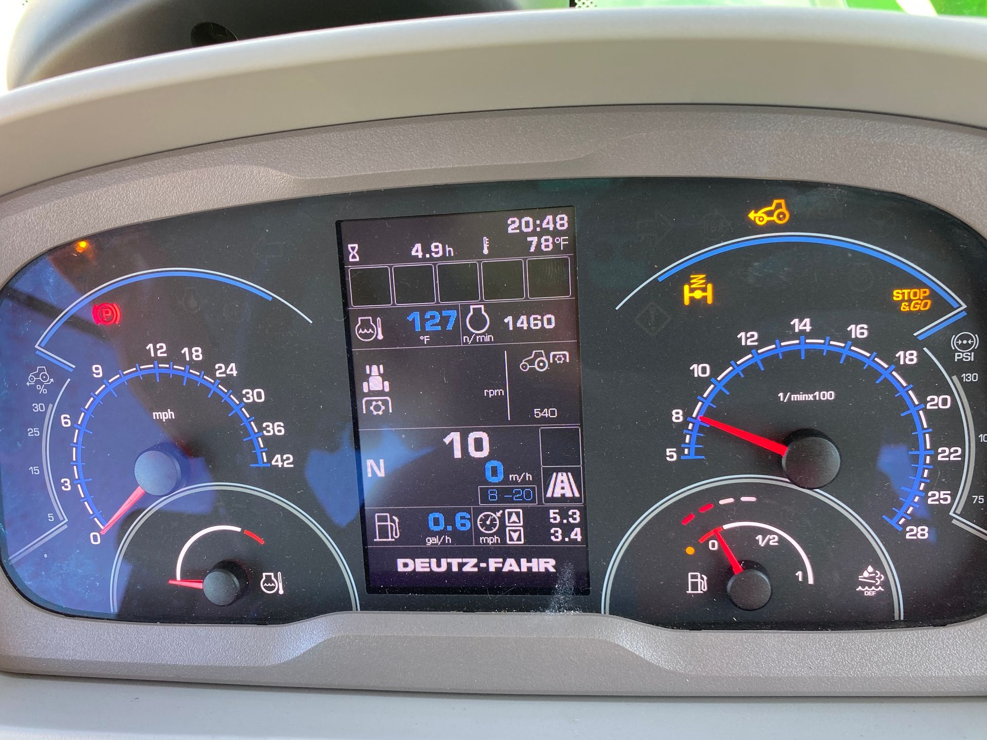Dashboard of a Deutz-Fahr tractor showing various engine metrics and warning lights.