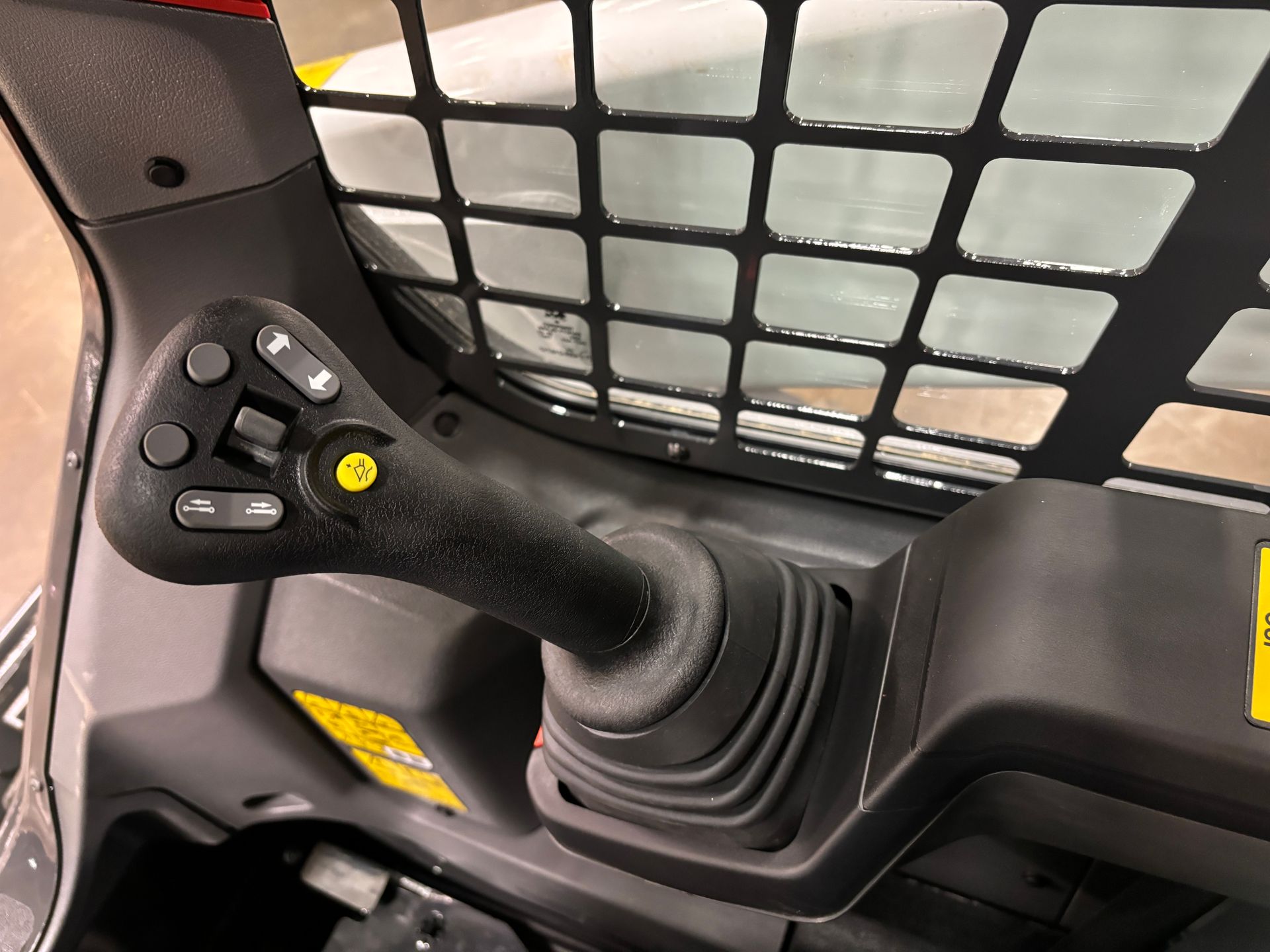 Joystick control panel inside a skid steer loader.