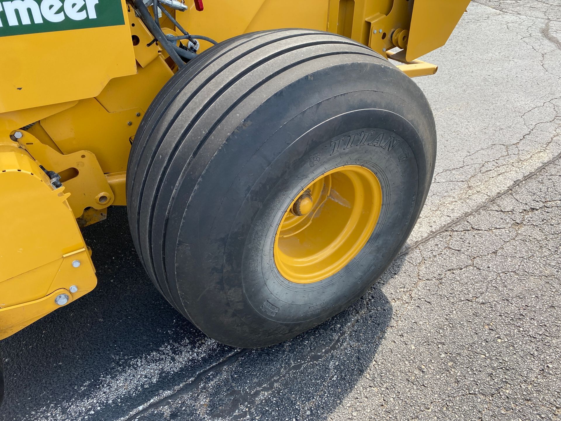 Yellow tire on yellow Vermeer equipment, outdoors.