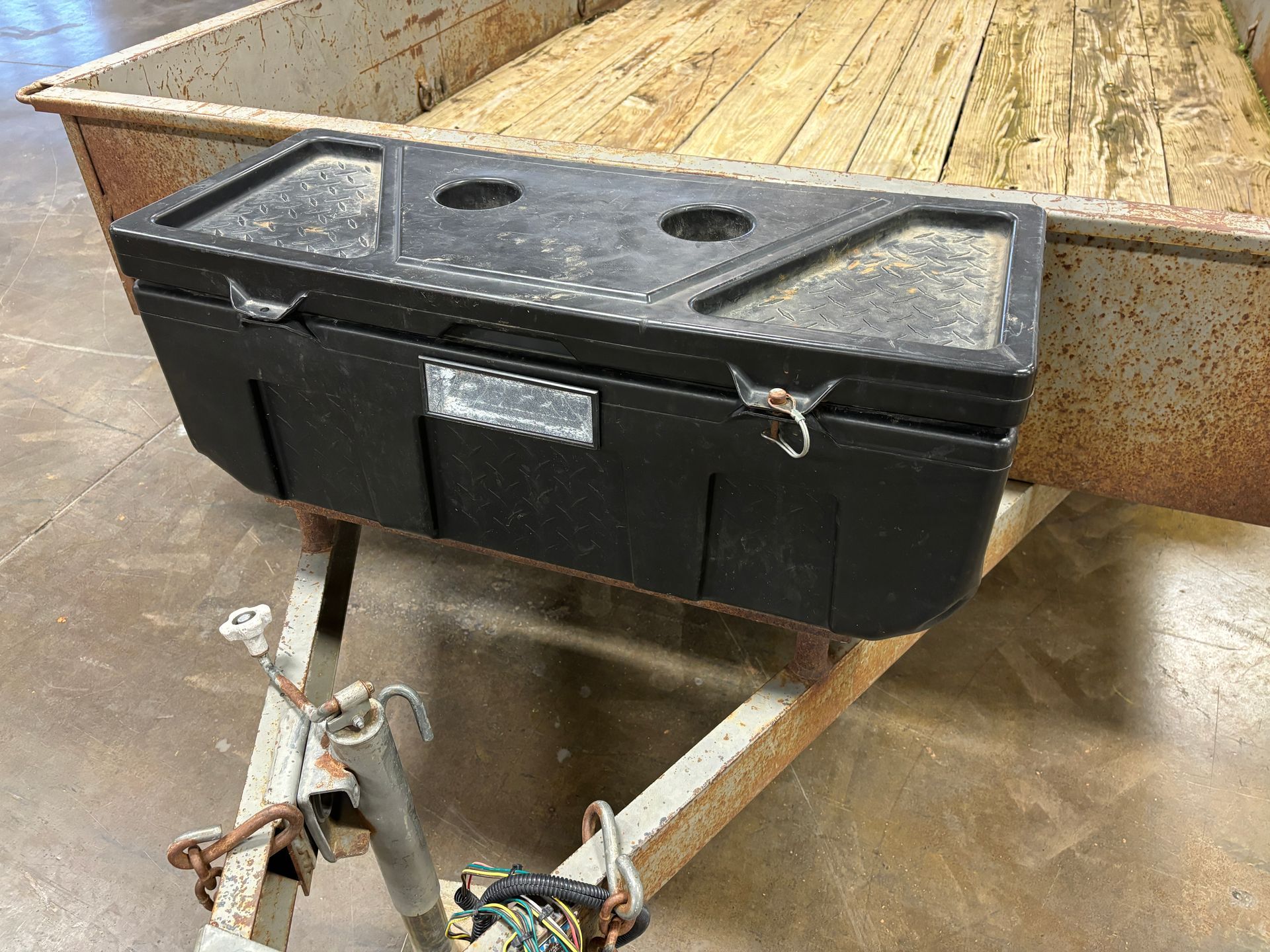 Black toolbox on a trailer.
