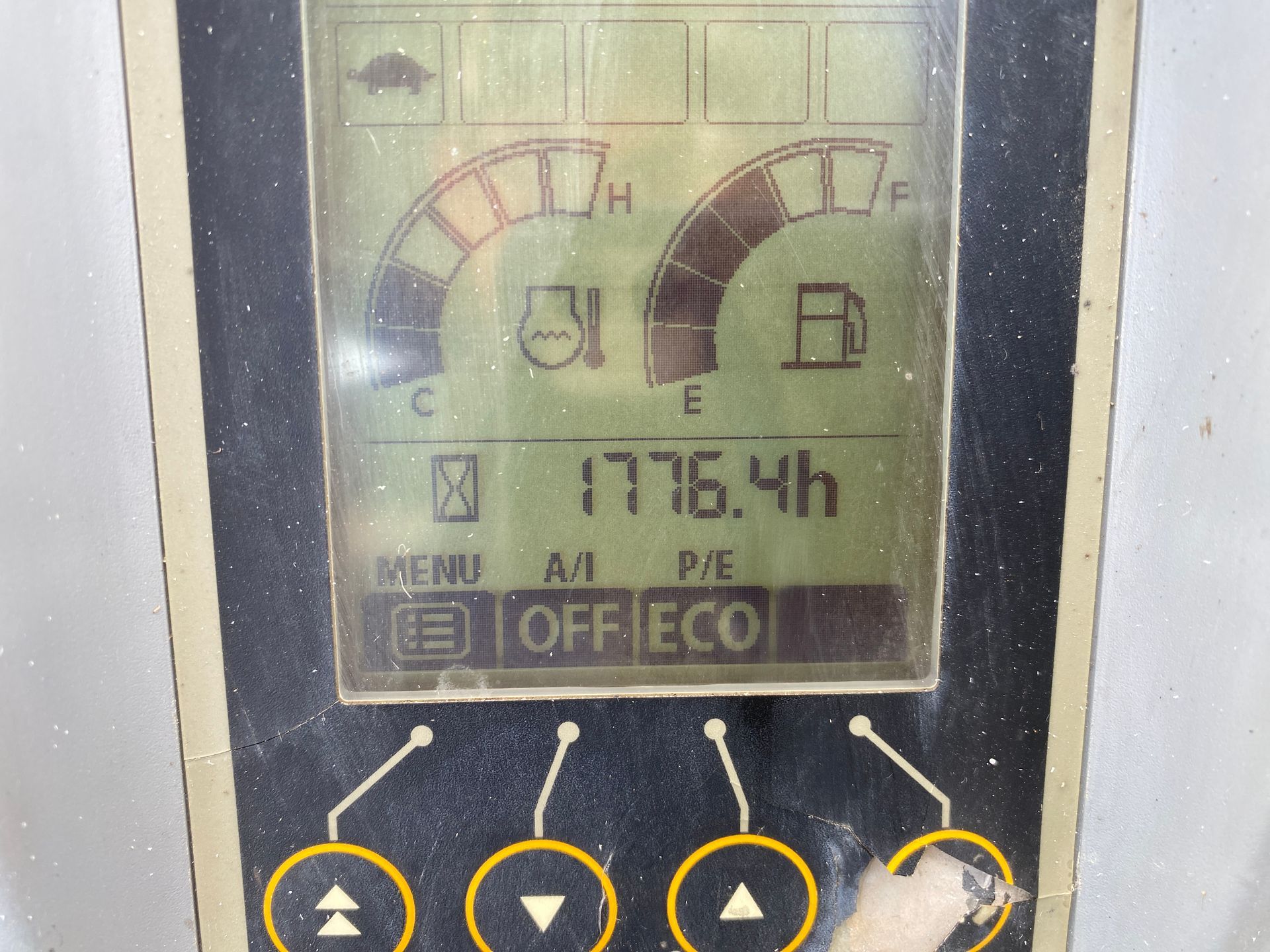 Display panel of a machine shows fuel level, temperature, and 1776.4 hours of operation.