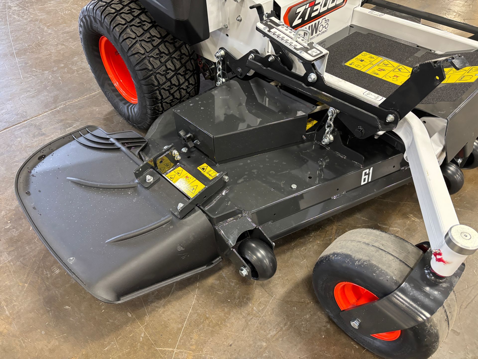 Bobcat zero-turn mower with a 61-inch deck; gray and black with orange wheels.